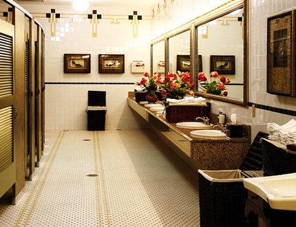 A clean washroom with beautiful flowers