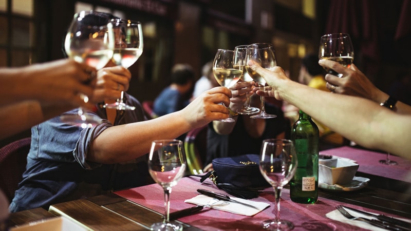 how to create a restaurant business plan group of people lifting their wine glass