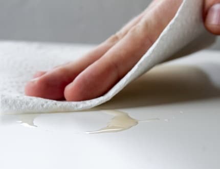 Wiping the table using paper towel