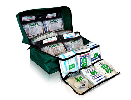 dark green first aid kit full of medical supplies