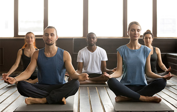 group of people doing a yoga post