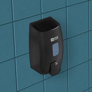 black soap dispenser mounted on the blue green wall