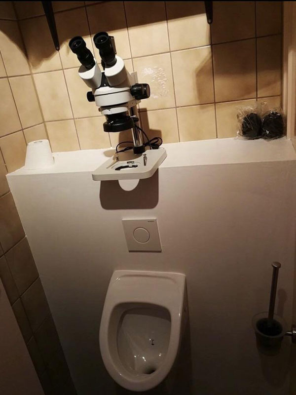 Urinal with microscope design
